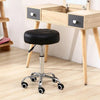 Black PU leather rolling stool chair by Global Star: Adjustable height and comfortable seating for office, salon, or spa.